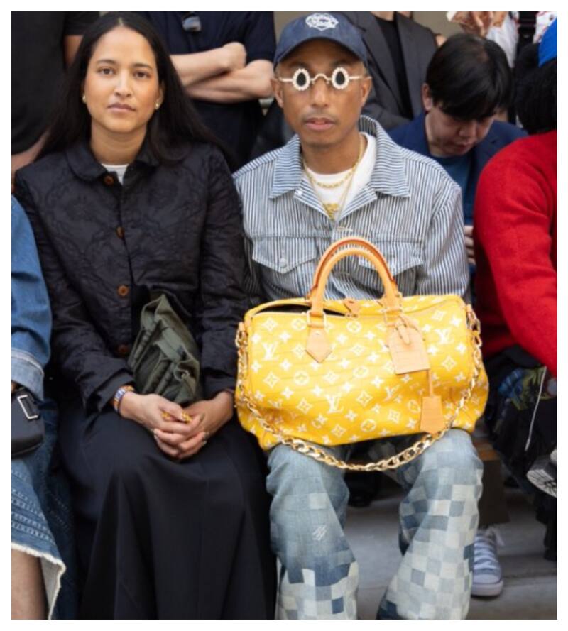 Pharrell Williams junto a su esposa Helen Lachisahn en París. El músico tiene hace 20 años su propia marca de vestuario: Billionaire Boys Club.