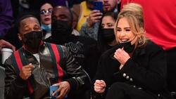 Adele goza con su novio en un juego de la NBA